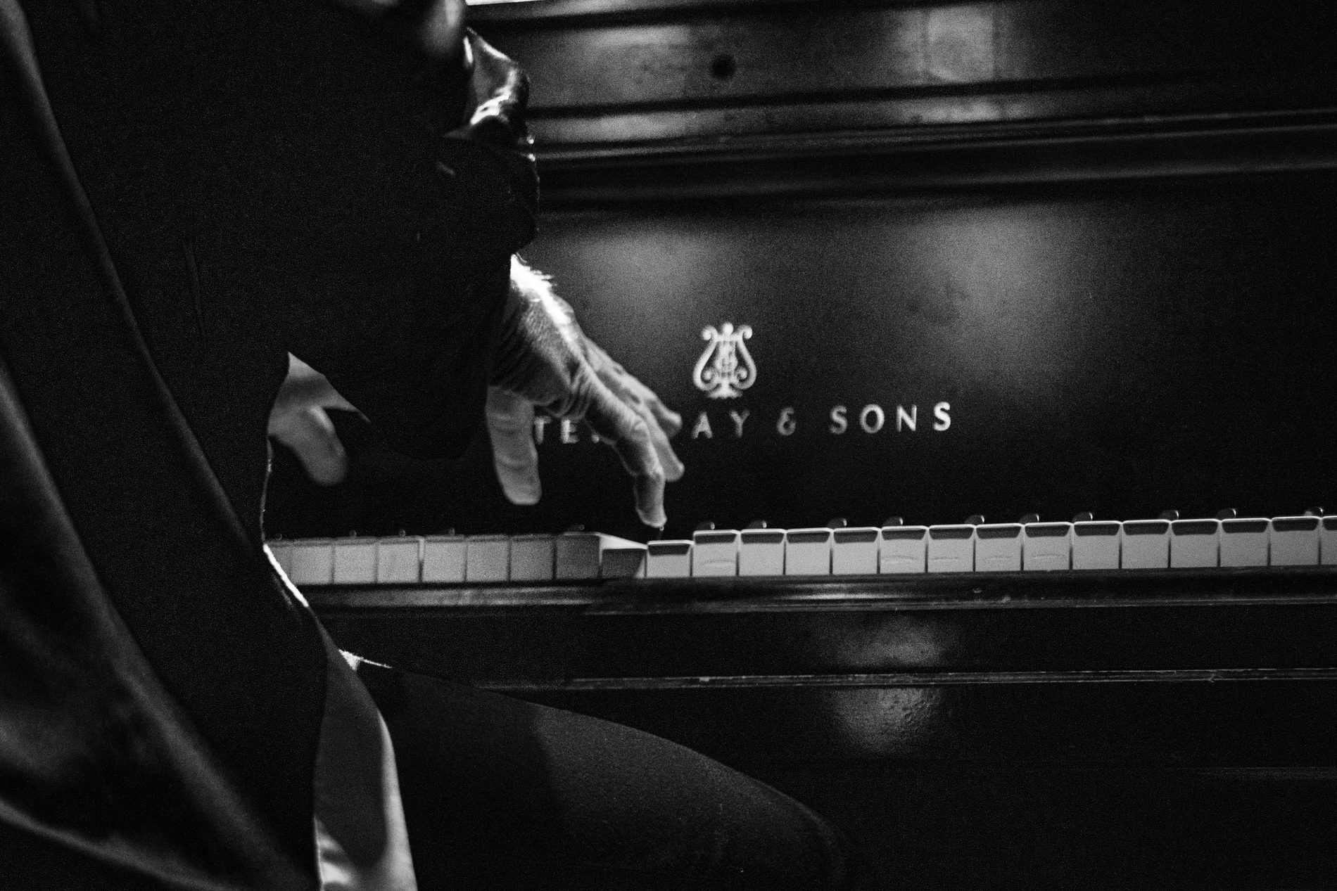 Black and white piano performance detail
